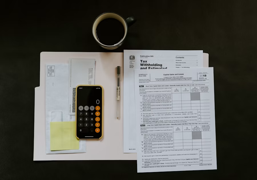 Renovation plans and budget documents on a desk